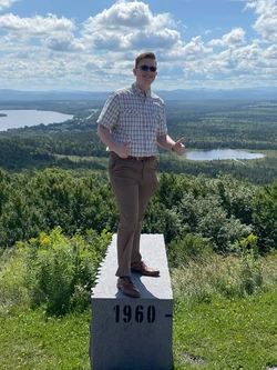 Alex Walley, tenor, in Quebec Canada on top of a mountain. He is there for songe d'ete en musique.